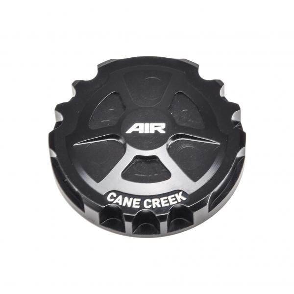 Helm fork positive charge air cap